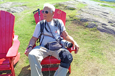 Me in red adirondack chair